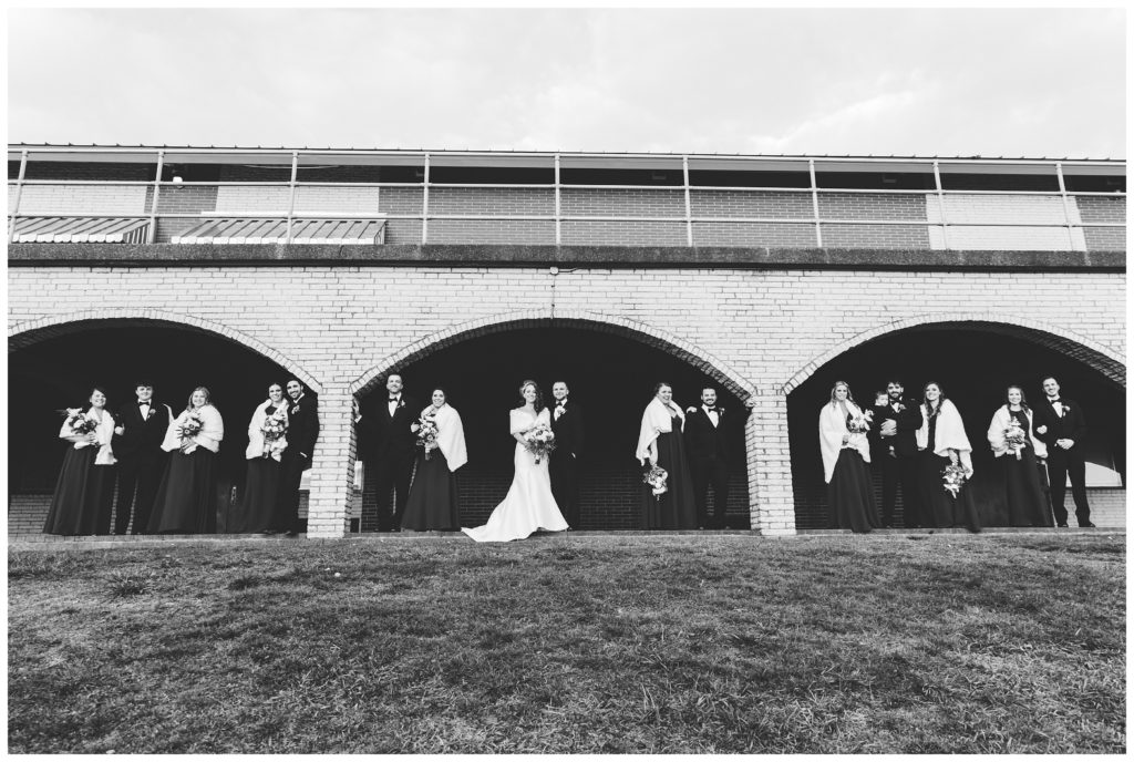 bridal party under arches at laube hall, freeport, pa