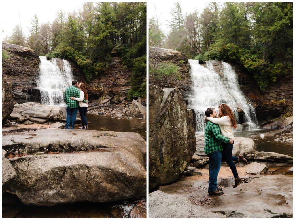 couple kissing in front of swallow falls waterfall