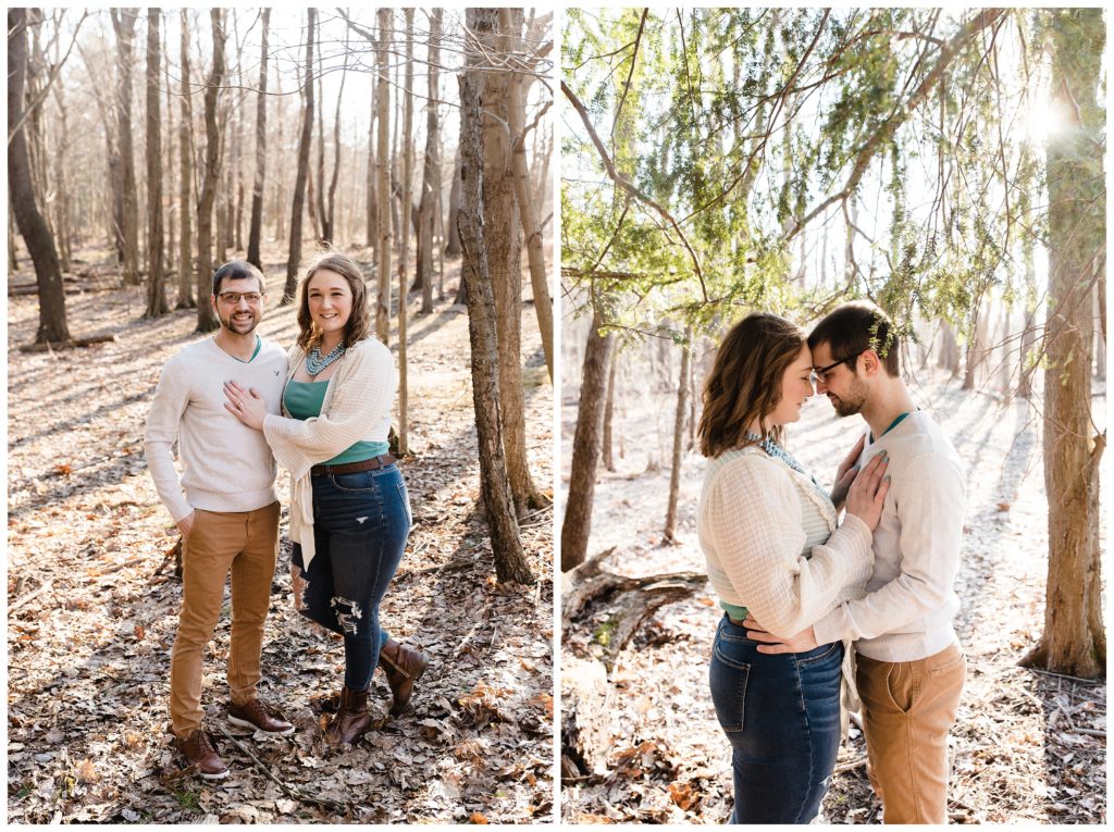 engaged couple embracing in woods