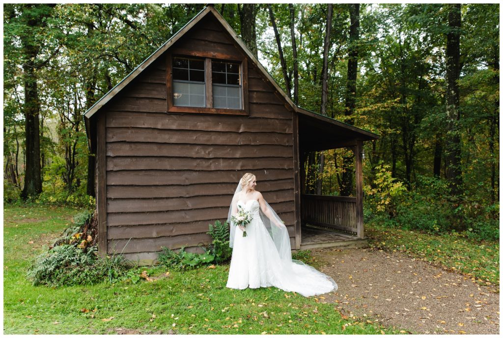bride outside of cabin