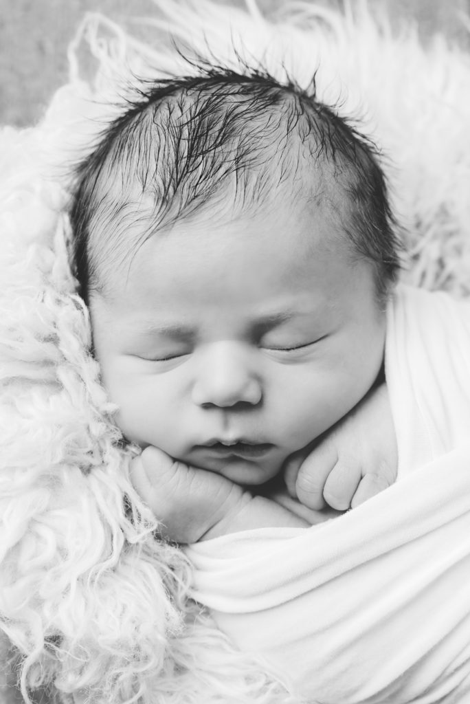 Black and white image of extreme close-up of baby boy showing his features | Pittsburgh Newborn Photographer