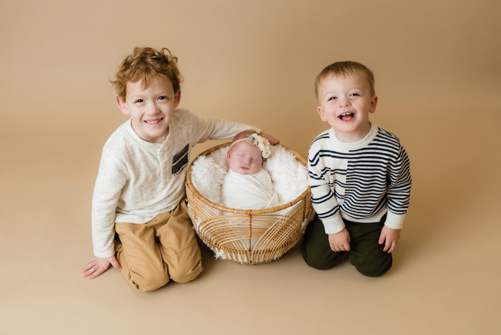 big brother sitting beside newborn sister in basket Pittsburgh Baby Photographer - Katie Louise Photography