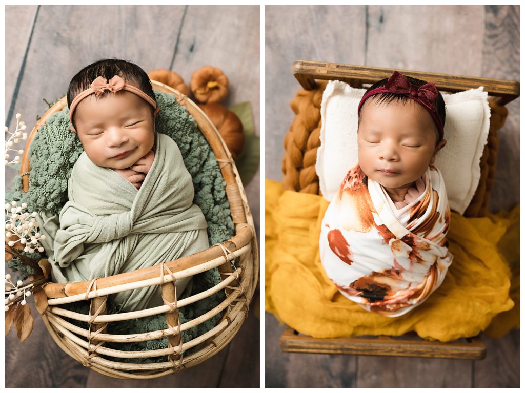 Newborn baby sleeping rattan basket with mini velvet pumpkins beside her.