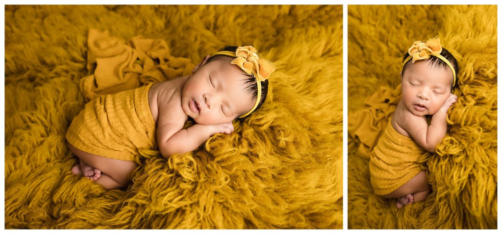 Newborn baby sleeping wrapped in mustard on faux flokati.
